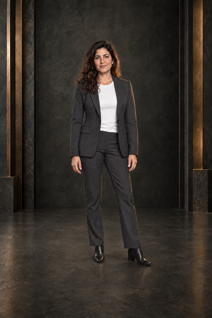 Business portrait in a dark studio with gold accents